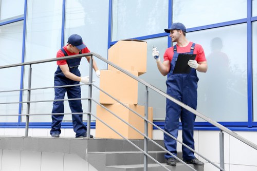 Worker loading boxes safely into a moving van