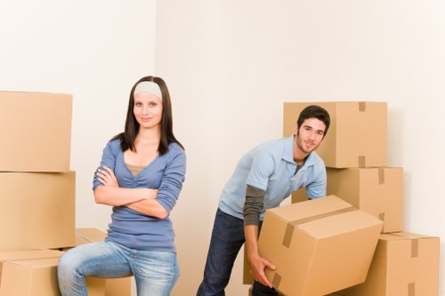 Removal crew preparing furniture for loading during a local move in Beddington