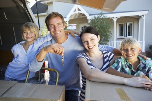 Trained movers handling furniture with care and communication