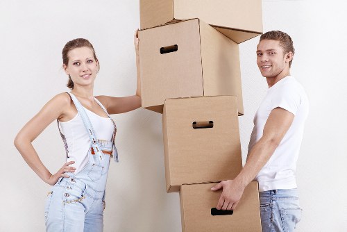 Boxes, desk, and luggage arranged for a student move in Beddington