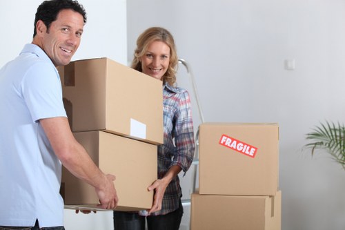 Boxes and furniture being prepared for a local flat removal service